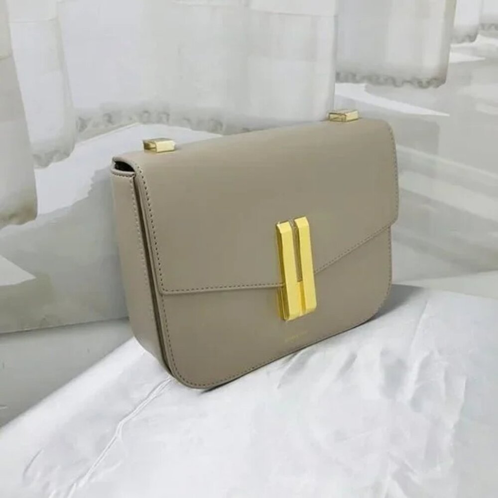 Demellier embossed-logo crossbody bag